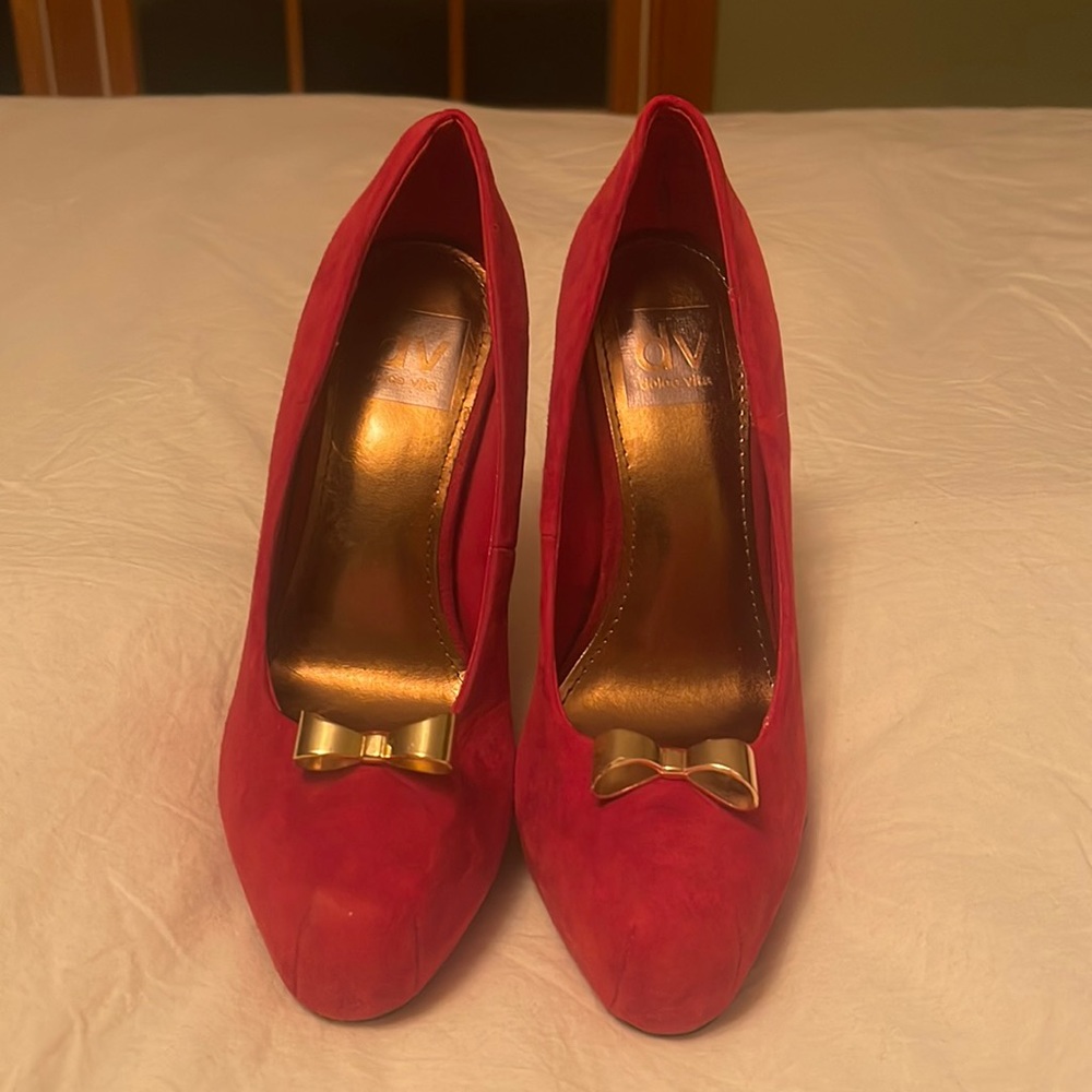 Red Suede pin up platforms with gold metallic bow. Gently worn
